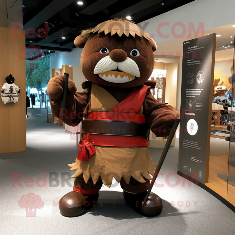 Brown Samurai mascot costume character dressed with a Trousers and Bow ties Brown Samurai mascot costume character dressed with a Trousers and Bow ties