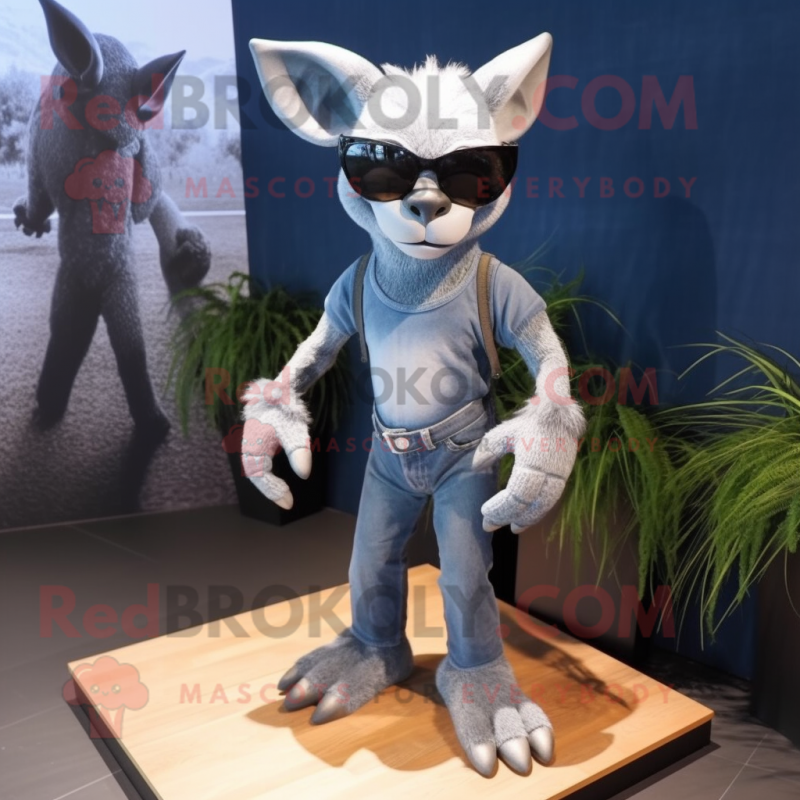 Silver Gargoyle mascot costume character dressed with a Bootcut Jeans and Sunglasses