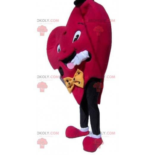 Hjerte maskot med en lille hat og en slips - Redbrokoly.com