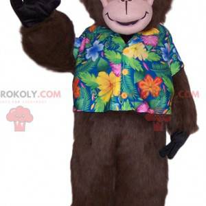 Apa maskot med en tropisk skjorta. Monkey kostym -