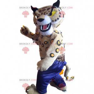 Mascotte de lynx beige avec un pantalon de sport bleu -