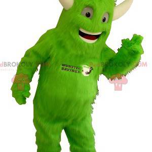 Mascotte de monstre vert tout poilu avec des cornes -