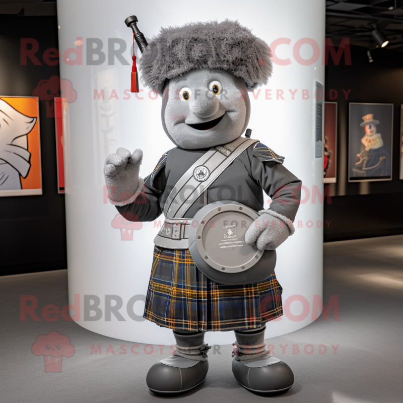 Gray Bagpipe mascot costume character dressed with a Graphic Tee and Cufflinks Gray Bagpipe mascot costume character dressed with a Graphic Tee and Cufflinks
