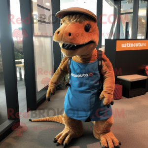 Rust Komodo Dragon mascot costume character dressed with a Romper and Messenger bags