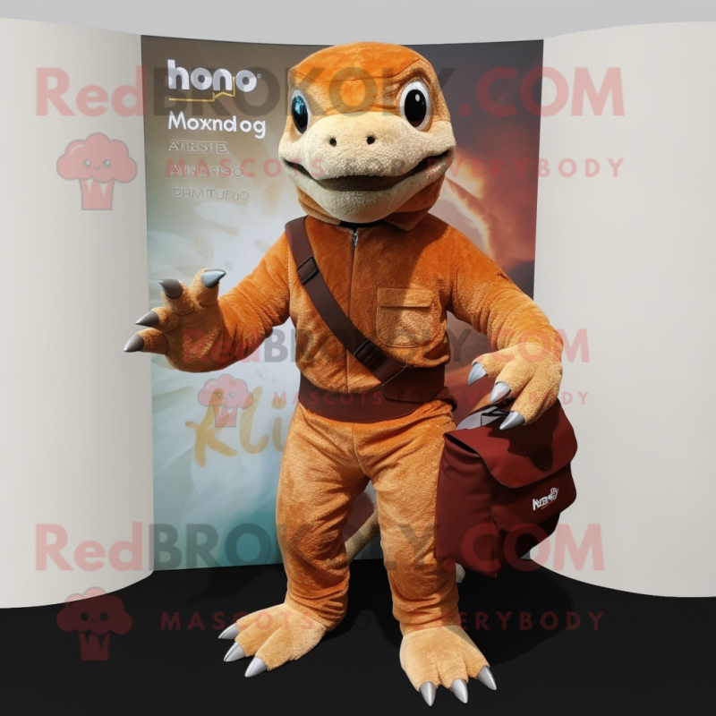 Rust Komodo Dragon mascot costume character dressed with a Romper and Messenger bags Rust Komodo Dragon mascot costume character dressed with a Romper and Messenger bags