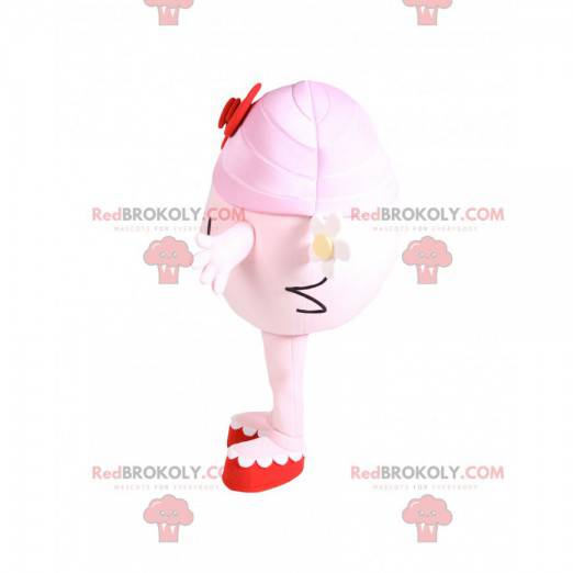 Menina mascote redonda e rosa com um laço vermelho -