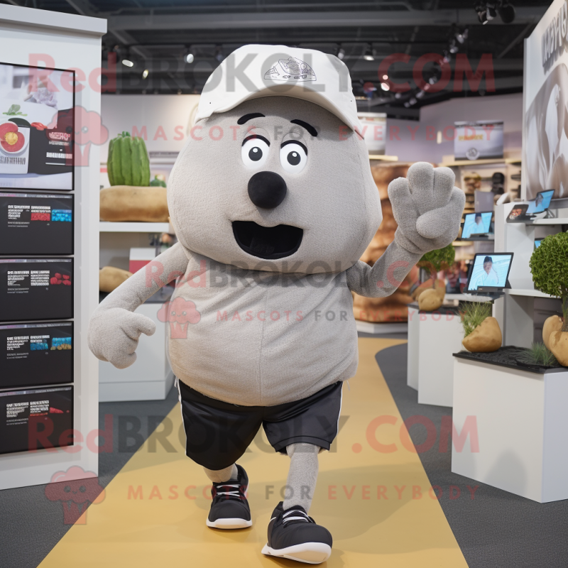 Gray Potato mascot costume character dressed with a Running Shorts and Hats