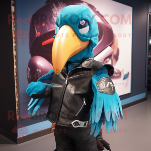 Cyan Toucan mascot costume character dressed with a Biker Jacket and Tote bags