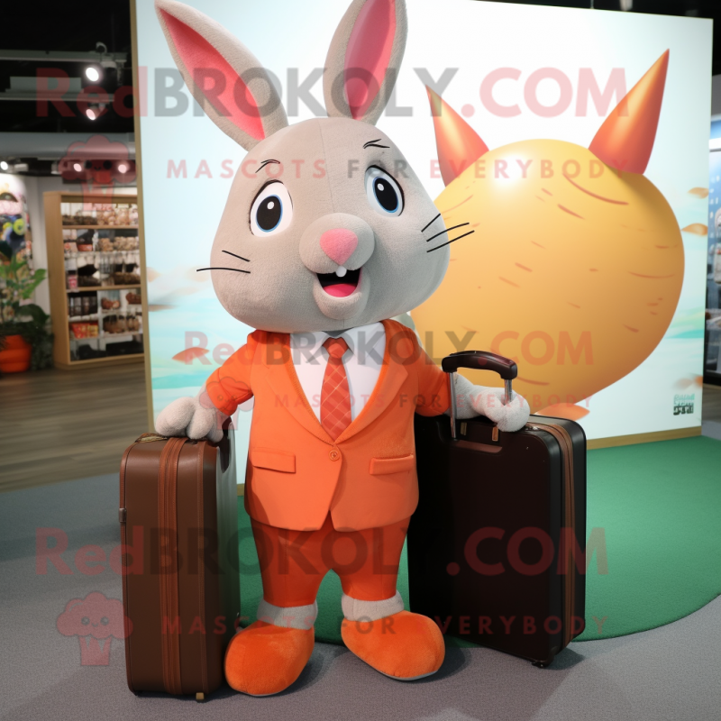 Peach Rabbit mascot costume character dressed with a Chinos and Briefcases