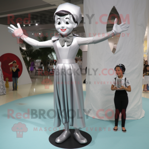 Silver Acrobat mascot costume character dressed with a Empire Waist Dress and Suspenders