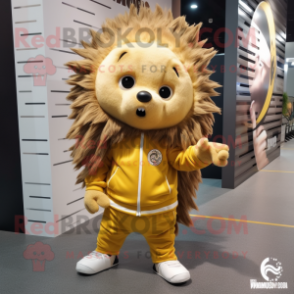 Gold Porcupine mascot costume character dressed with a Joggers and Shoe laces