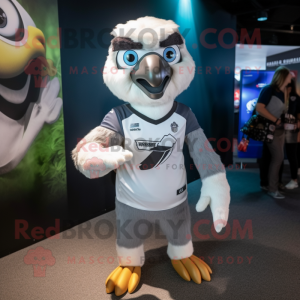 Silver Falcon mascot costume character dressed with a Rugby Shirt and Headbands