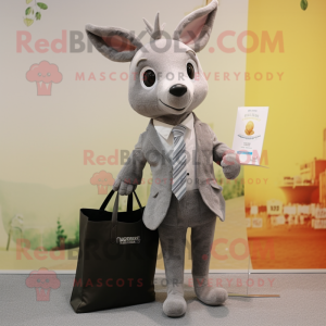 Gray Roe Deer mascot costume character dressed with a Suit Jacket and Tote bags