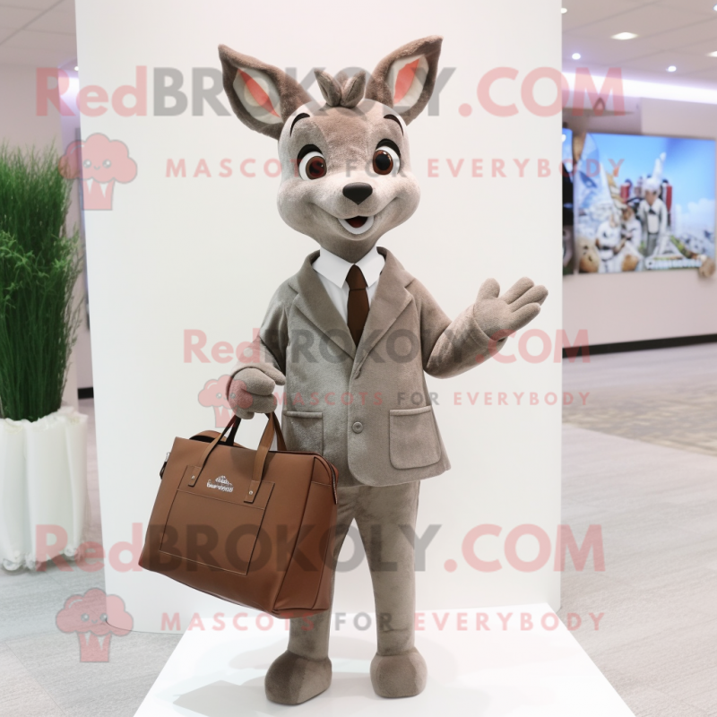 Gray Roe Deer mascot costume character dressed with a Suit Jacket and Tote bags Gray Roe Deer mascot costume character dressed with a Suit Jacket and Tote bags