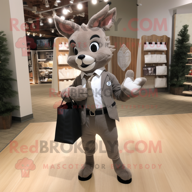 Gray Roe Deer mascot costume character dressed with a Suit Jacket and Tote bags