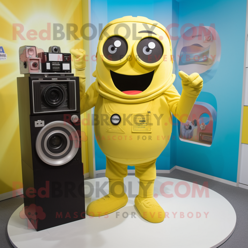 Yellow Camera mascot costume character dressed with a Romper and Ties Yellow Camera mascot costume character dressed with a Romper and Ties