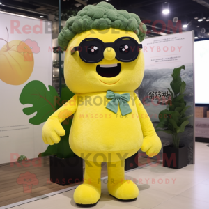 Lemon Yellow Broccoli mascot costume character dressed with a Bodysuit and Reading glasses