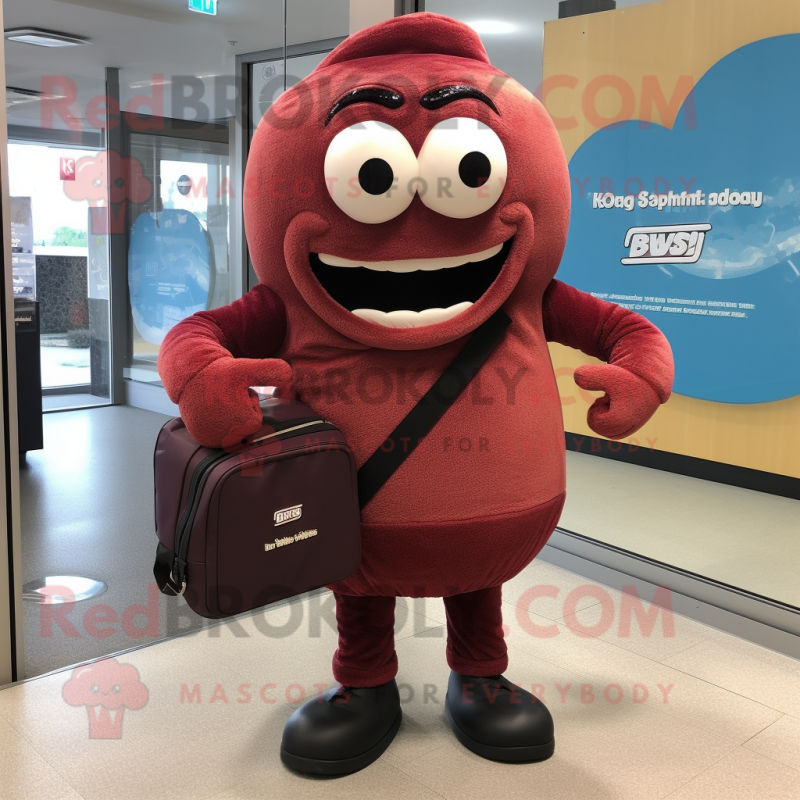 Maroon Donut mascot costume character dressed with a Hoodie and Briefcases Maroon Donut mascot costume character dressed with a Hoodie and Briefcases