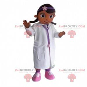 De kleine meisjesmascotte kleedde zich als arts. -