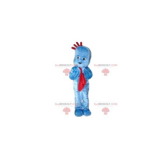 Mascota de muñeco de nieve azul con una manta roja -