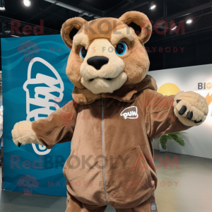 Brown Puma mascot costume character dressed with a Windbreaker and Wraps