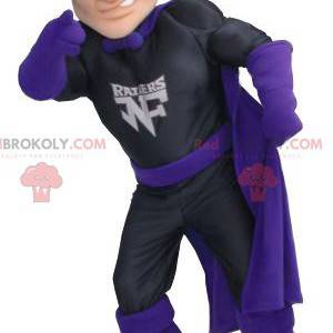 Superhero Zorro mascot in black and purple outfit -