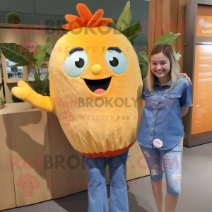 Orange Mango mascot costume character dressed with a Chambray Shirt and Hair clips