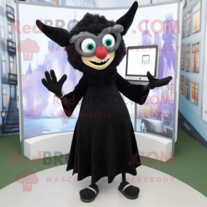 Black Tooth Fairy mascot costume character dressed with a Cardigan and Eyeglasses
