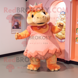 Peach Ankylosaurus mascot costume character dressed with a A-Line Skirt and Mittens
