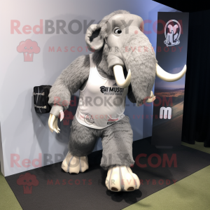 Silver Mammoth mascot costume character dressed with a Running Shorts and Briefcases