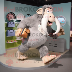 Silver Mammoth mascot costume character dressed with a Running Shorts and Briefcases