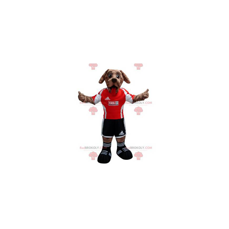 Brun hundemaskot i svart og rødt fotballspillerantrekk -