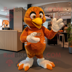 Orange Eagle mascot costume character dressed with a Sweater and Rings