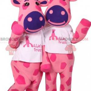 Maskottchen von zwei rosa Giraffen mit lila Flecken -