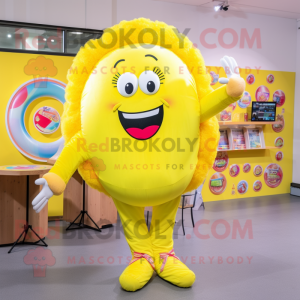 Lemon Yellow Donut mascot costume character dressed with a Jumpsuit and Hair clips