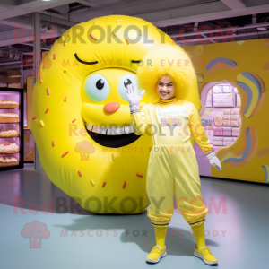 Lemon Yellow Donut mascot costume character dressed with a Jumpsuit and Hair clips