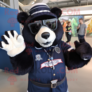 Navy Spectacled Bear mascot costume character dressed with a Graphic Tee and Mittens