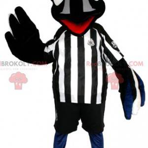 Mascote pássaro preto com roupa de futebol. Fantasia de pássaro