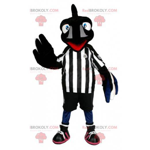 Mascote pássaro preto com roupa de futebol. Fantasia de pássaro