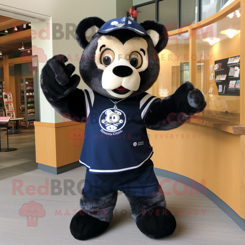 Navy Spectacled Bear mascot costume character dressed with a Graphic Tee and Mittens