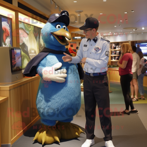 Navy Kiwi mascot costume character dressed with a Oxford Shirt and Watches