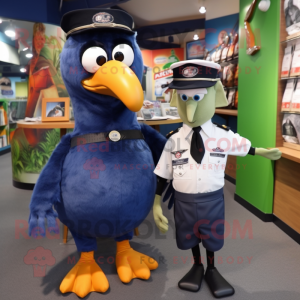 Navy Kiwi mascot costume character dressed with a Oxford Shirt and Watches