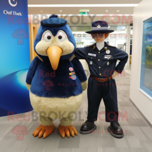 Navy Kiwi mascot costume character dressed with a Oxford Shirt and Watches