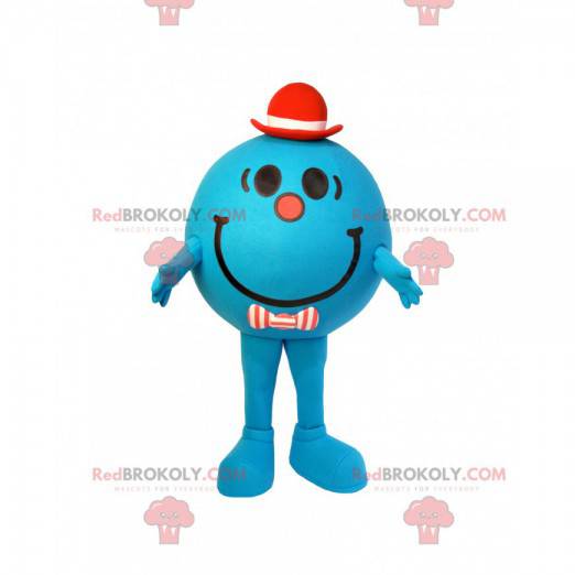 Mascotte de petit bonhomme bleu et rond avec un chapeau rouge -
