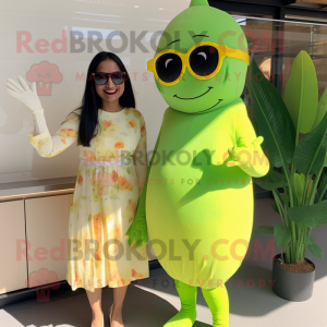 Lime Green Tikka Masala mascot costume character dressed with a Midi Dress and Sunglasses