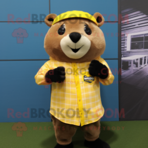 Yellow Otter mascot costume character dressed with a Flannel Shirt and Digital watches