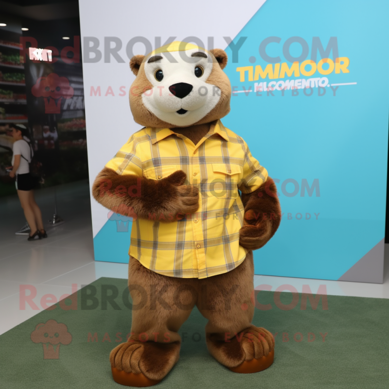 Yellow Otter mascot costume character dressed with a Flannel Shirt and Digital watches