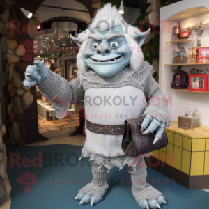 Silver Ogre mascot costume character dressed with a Sweater and Handbags