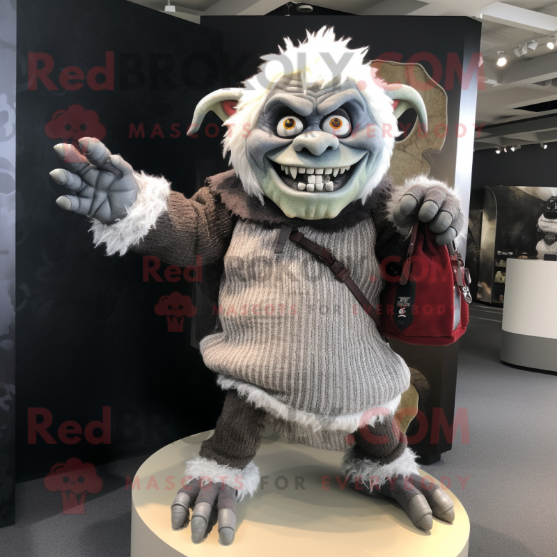 Silver Ogre mascot costume character dressed with a Sweater and Handbags Silver Ogre mascot costume character dressed with a Sweater and Handbags