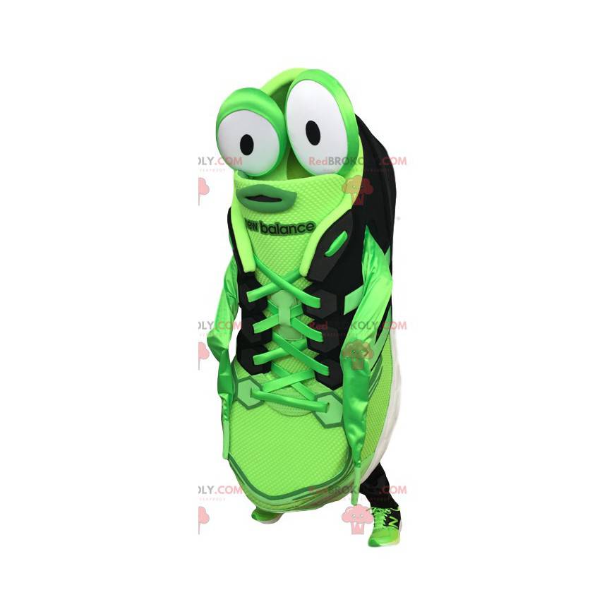 Mascota de zapato deportivo verde y negro con ojos grandes -